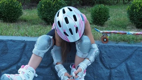 Child dresses roller skates. Stock Footage 77966815