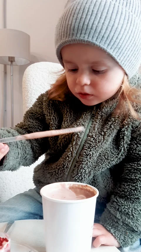 Child Drinking Cocoa and Eating Dessert Indoor Scene Видео 332656773