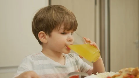 Child drinking juice Stock Footage 100001182