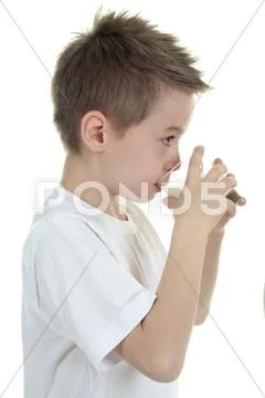Child drinking milk on white background Stock Photos