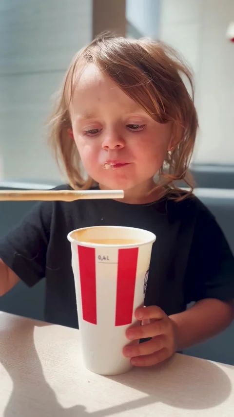 Child Drinking Milkshake at Cafe Table Family Lifestyle Stock Footage 338321873