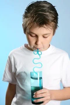 Child drinking through a straw Stock Photos