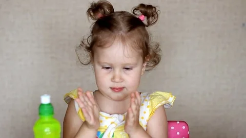 A child drinks juice from a bottle. Video stock 78059826