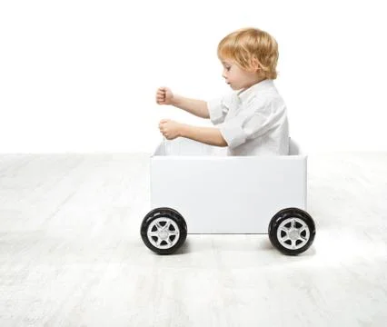 Child driving box car. Creativity and innovation concept Stock Photos