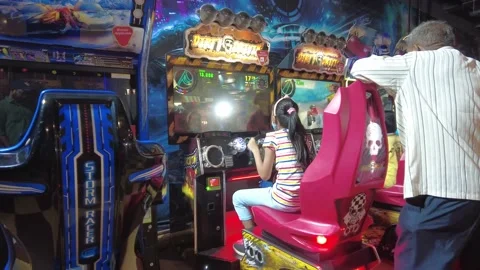 Child driving simulator game on pc computer. Young girl using play station game. Stock Footage 196225880