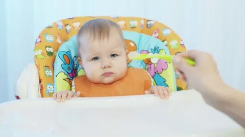 The child dutifully eat with a spoon Stock Footage 72680557