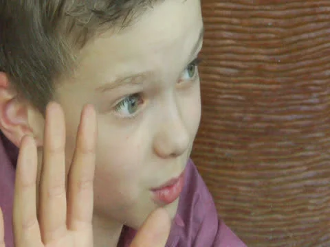 Child eagerly seeing something from his home Stock Footage 22919440