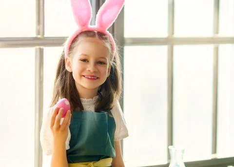 Child with Easter painting egg Stock Photos