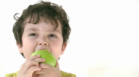 Child eating apple Stock Footage
