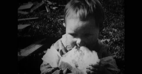 Child eating bread Stock Footage 43502615