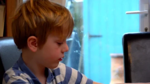 Child eating breakfast Stock Footage 98927912