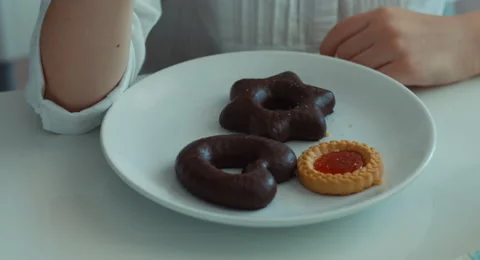 Child eating a cookie 動画素材 49837721