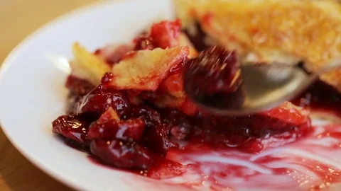 Child is eating fruit pie 스톡 동영상 82544028