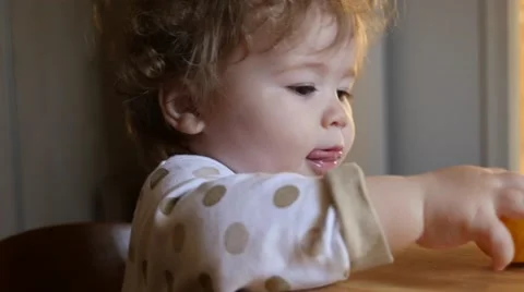 Child eating orange Stock Footage 49949673
