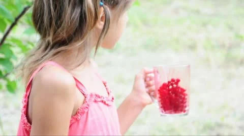 Child eating red current Stock Footage