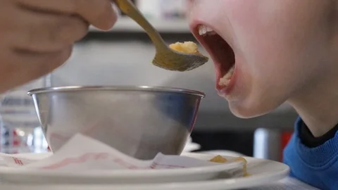 Child eating soup Video stock 103147265