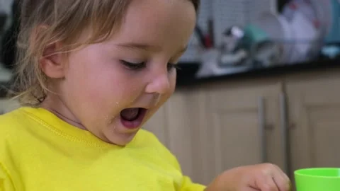 Child eating with spoon Stock Footage 170534285