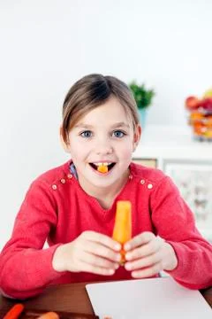 Child eating vegetable Stock Photos
