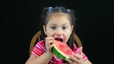 Child eating watermelon slice Stock Footage 11037259