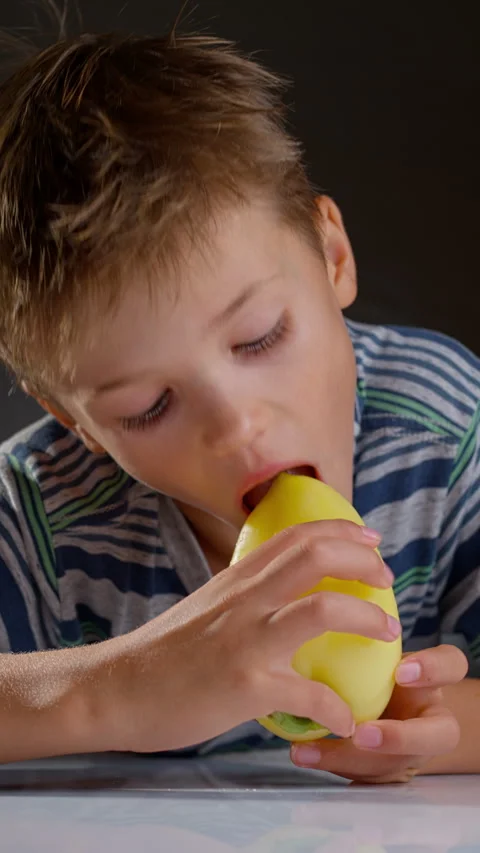 Child eating yellow pepper Stock Footage 314993695