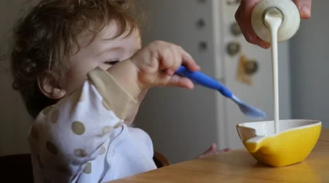 Child eating yogurt Stock Footage 49949670