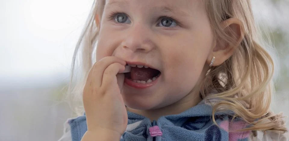 Child eats ascorbic vitamins. Cold flu prevention Selective focus Photos