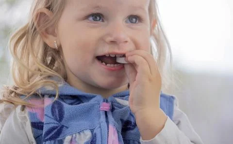 Child eats ascorbic vitamins. Cold flu prevention Selective focus Stock Photos