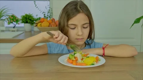 The child eats boiled vegetables. Selective focus. Stock Footage 170427851