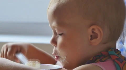 Child eats a Breakfast porridge Stock Footage 65262867