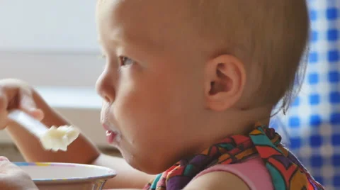Child eats a Breakfast porridge Stock Footage 65262903