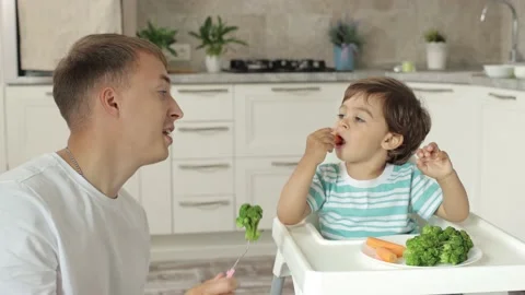 The child eats broccoli. Organic food. healthy vegetables rich in vitamins Stock-Footage 238765273