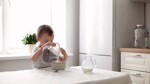 The child eats cereal Stock Footage 220285359