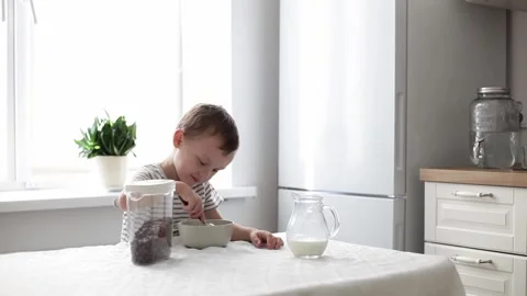 The child eats cereal Stock Footage 220285363