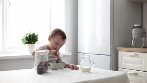 The child eats cereal Stock Footage 220285366