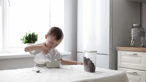 The child eats cereal Stock Footage 220285368
