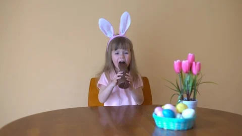 Child Eats A Chocolate Hare. Stock Footage 105085519