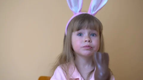 Child Eats A Chocolate Hare. Stock Footage 105089208