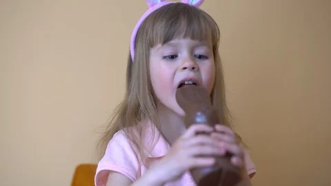 Child Eats A Chocolate Hare. Stock Footage 105090137