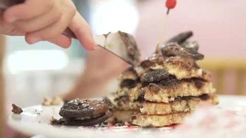 A child eats chocolate waffles in a restaurant Stock Footage 249599452
