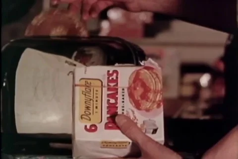 Child eats cold cereal from the box, a boy spreads toothpaste on a brush - 1958 Vídeo Stock 106268280