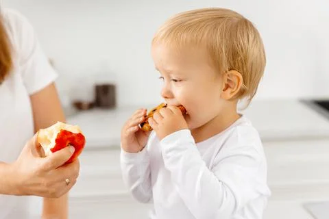 A child eats cookies and refuses to eat right and eat healthy. Reducetarian Photos