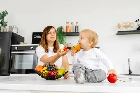 A child eats cookies and refuses to eat right and eat healthy. Reducetarian Stock Photos