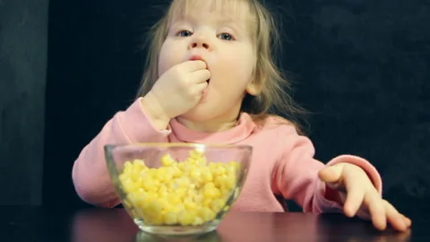 Child eats with hands Stock Footage 86318590