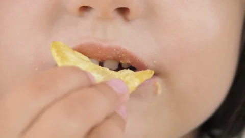 The child eats harmful food. Stock Footage 94641412