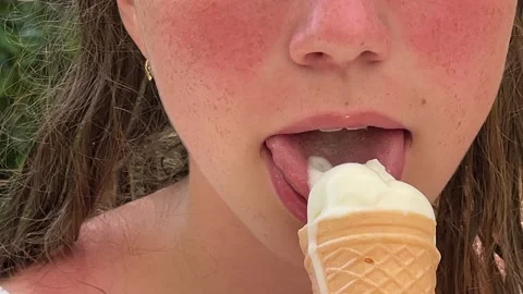 A child eats ice cream in a close-up frame Stock Footage 246443300