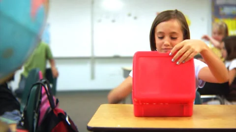 Child eats lunch at school Stock Footage 32708261