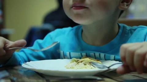 The child eats the pancakes with cottage chees Stock Footage 50374668