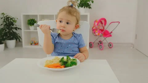 The child eats pasta and vegetables. Selective focus. Stock Footage 172104314