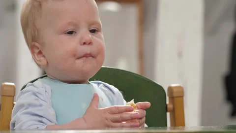 A child eats a piece of bread Stock Footage 336122105