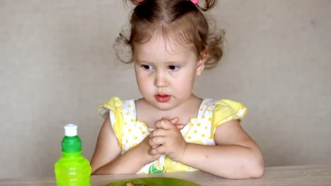 The child eats pizza and drinks lemonade. Cafe and fast food. Video stock 78059494